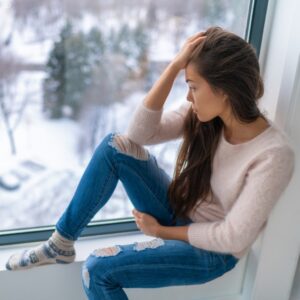 Winter,Depressed,Sad,Girl,Lonely,By,Home,Window,Looking,At