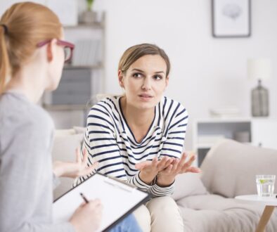 Psychiatrist,Listening,To,Her,Patient,Who,Experienced,Traumatic experience therapist listening to client and talking